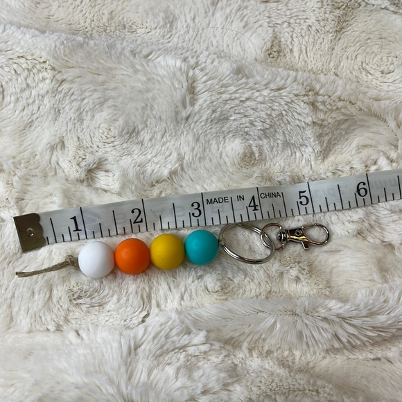Handmade 15mm silicone bead keychain or zipper pull. Teal/yellow/orange/white. - Picture 3 of 3